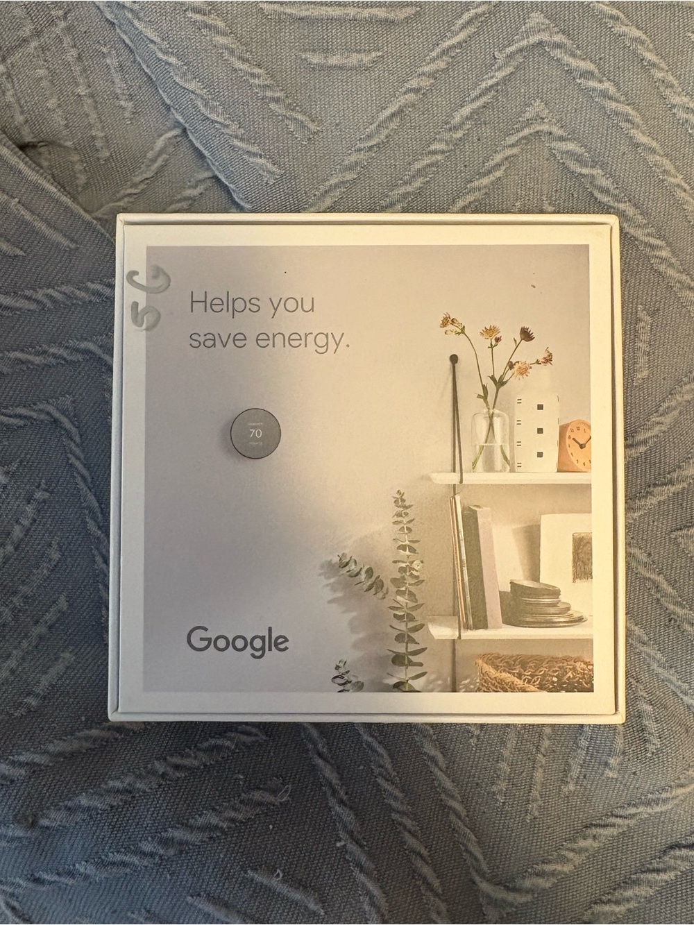 google smart thermostat in white and gray box